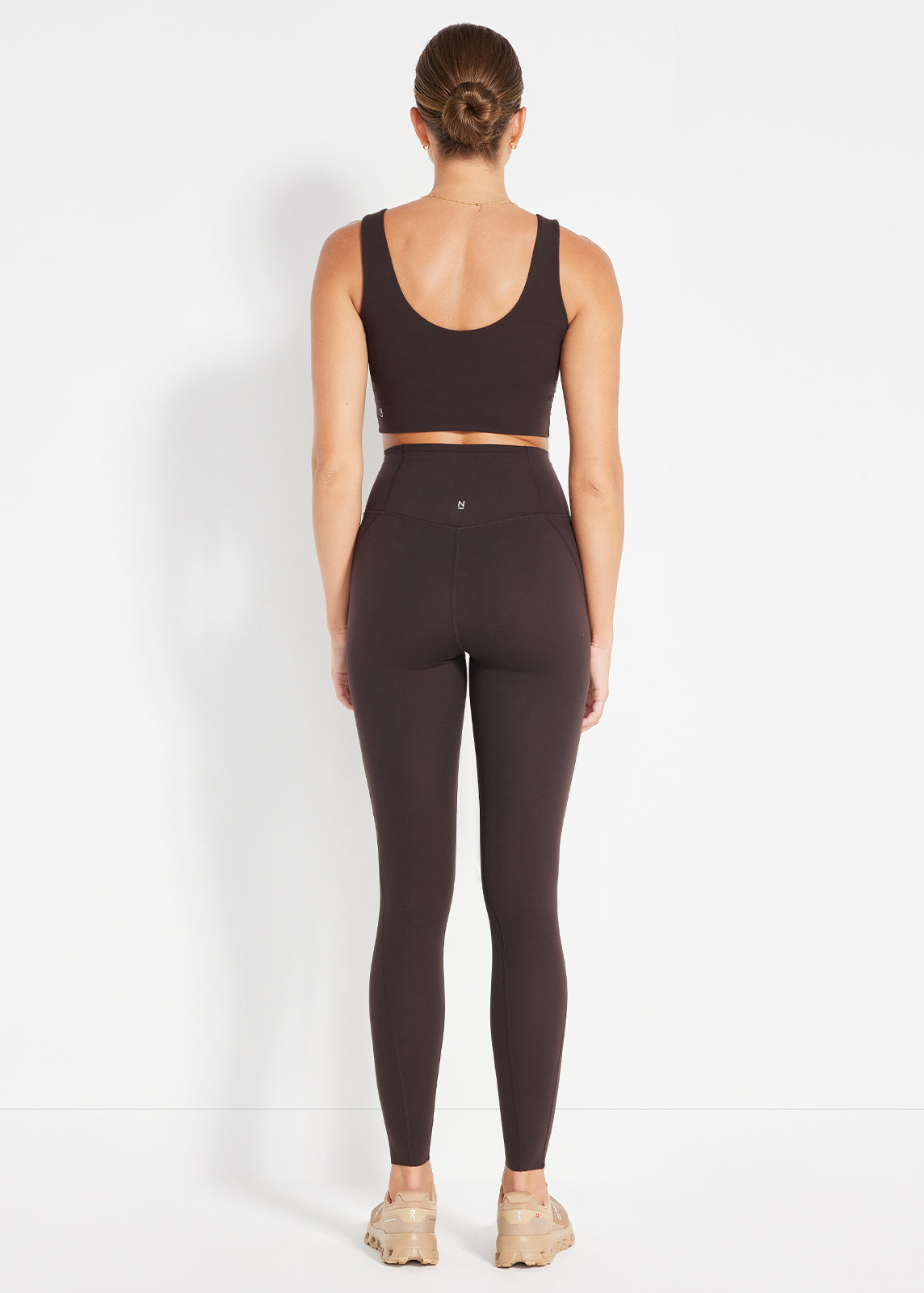Back view of espresso scoop crop and matching leggings designed for everyday comfort