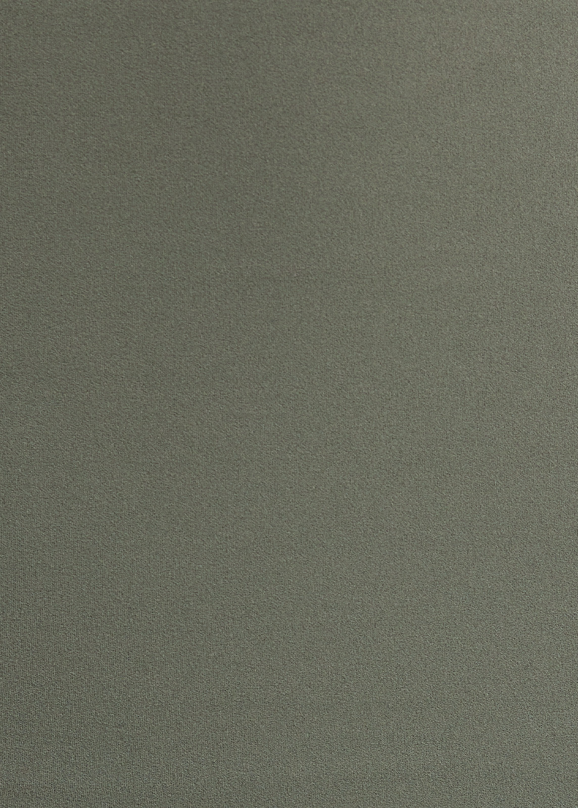 Fabric close-up showing sage green stretch material texture